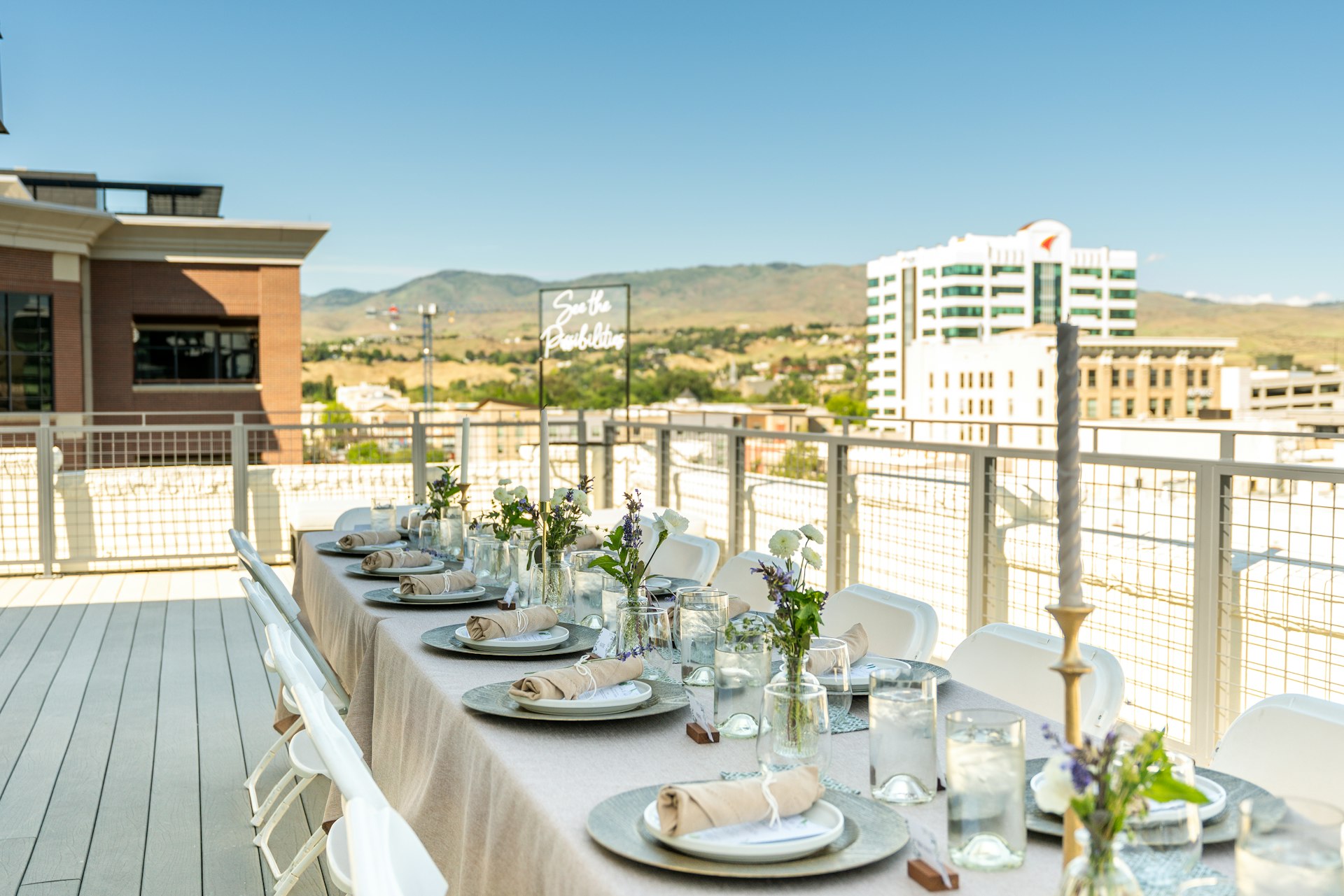 A rooftop dining table set for an elegant event.